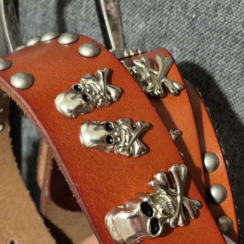 THE LATHER BARN Orange Leather Belt with Silver Skull Accents